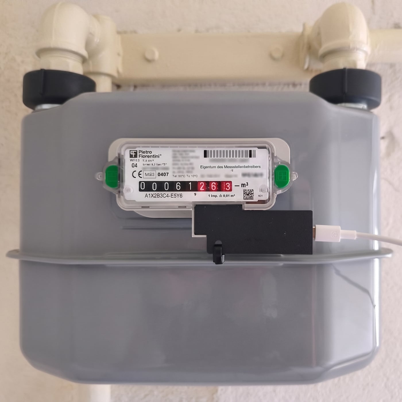 Abbildung 3.1a: SmartGas Impulszähler Plus SG-IZ-Plus-P montiert am Pietro Fiorentini Gaszähler